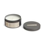 White candle in a black tin with a matching lid