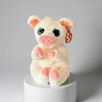 Cream and pink plush pig toy with large blue eyes