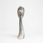 Ceramic angel figurine with blue accents on a white background