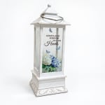 White lantern with blue floral print and memorial text