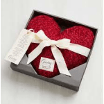 Heart-shaped red gift box tied with a white ribbon