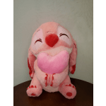 Pink plush toy holding a heart