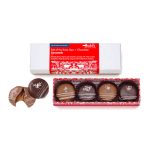 Box of chocolate caramels with one broken piece shown beside it