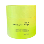 Lime green candle jar labeled Rosemary + Sage