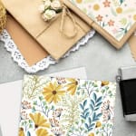 Assorted wrapped gift packages with floral paper and twine