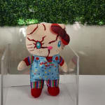Plush doll with stitched face details and colorful clothes