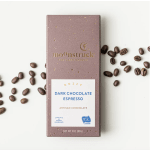 Box of dark chocolate espresso with coffee beans scattered around it