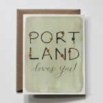 Greeting card with the words "PORTLAND loves you!" on a brown envelope