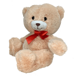 Beige teddy bear with a red ribbon bow