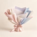 Pastel paper bouquet wrap tied with a satin ribbon