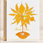 Thank you card with a gold floral illustration and script text