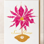 Pink poinsettia illustration on a greeting card with gold text