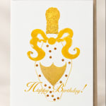 Birthday card with a gold decorative vase and "Happy Birthday!" text