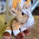 Plush reindeer toy with brown and white fur