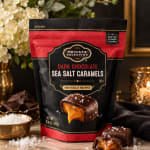 Bag of dark chocolate sea salt caramels with wrapped candies and salt crystals