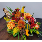Autumn centerpiece with orange roses, mums, red flowers and gourds in a woven cornucopia
