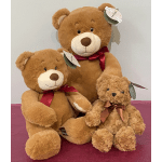 Three teddy bears with ribbons, including a large bear and a small plush bear
