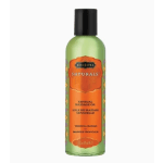 Bottle of tropical mango sensual massage oil with orange label and black cap