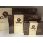 Three boxes of Coblentz Deluxe Assortment chocolates stacked together