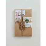 Brown paper gift bundle tied with twine and tea packets
