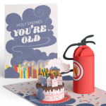 Birthday card with a cake pop-up and a red fire extinguisher gift box