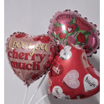 Three heart-shaped Valentine balloons with roses and love messages