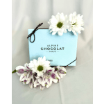 Blue chocolate box with white daisies and purple-white flowers
