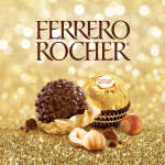 Ferrero Rocher chocolates on a gold background with hazelnuts