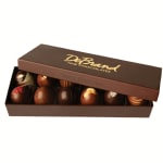 Box of assorted chocolate truffles with a partially open lid