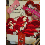 Heart-shaped chocolate boxes with Valentine signs and ribbons
