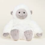 White plush stuffed animal with a gray face and feet