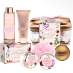 Cherry blossom bath gift set with lotion, scrub, and bath items in pink packaging