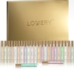 Gold perfume gift set with multiple small fragrance vials arranged in front of a box