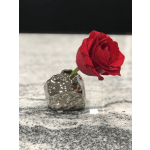 Single red rose in a small metallic vase