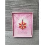Pink gift box with a flower-shaped pendant necklace