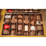 Box of assorted chocolates in divided compartments