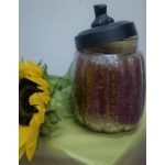 Sunflower arrangement beside a glass jar with a black lid