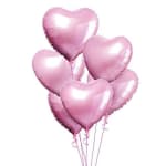 Cluster of pink heart-shaped balloons on strings