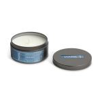 A gray tin candle with a lid beside it