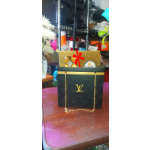 Gift bag with Ferrero Rocher chocolates on a table