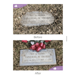 Grave marker decorated with a red floral tribute and ribbon
