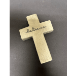 Stone cross with the word "believe" written across it