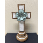 Wooden cross with a blue succulent accent on a stand