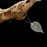 sceleton leaf pendant on long necklace