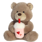 Plush teddy bear holding a pink drink cup with hearts