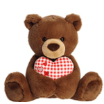 Brown teddy bear holding a red-and-white heart