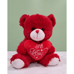 Red teddy bear holding a heart with "Te Amo" text