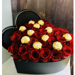 Heart-shaped box filled with red roses and gold-wrapped chocolates