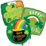 Three St. Patrick's Day balloons with shamrocks and rainbow designs