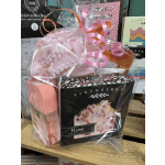 Gift basket with pink bath items and boxed Finchberry soap wrapped in clear cellophane